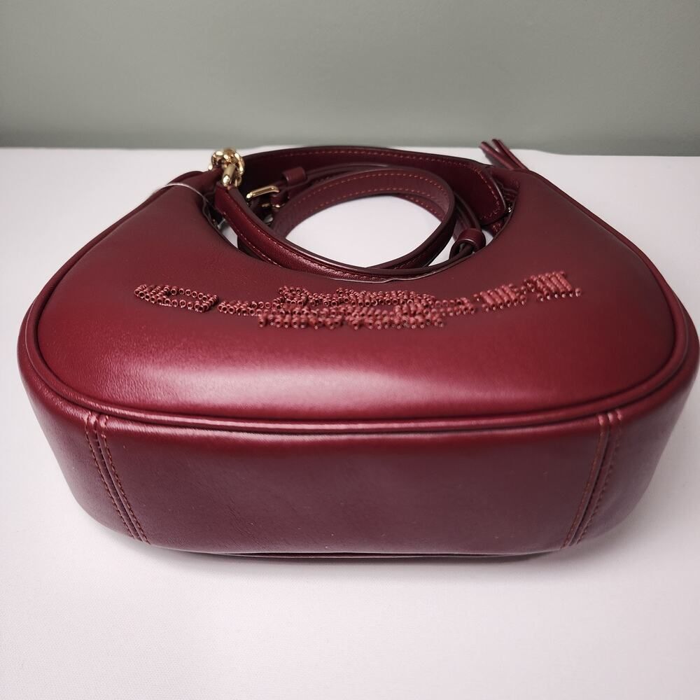 NWT Coach CCE60 Carmen Mini Crossbody Beaded Coach Graphic In DARK WINE Leather - Picture 2 of 7